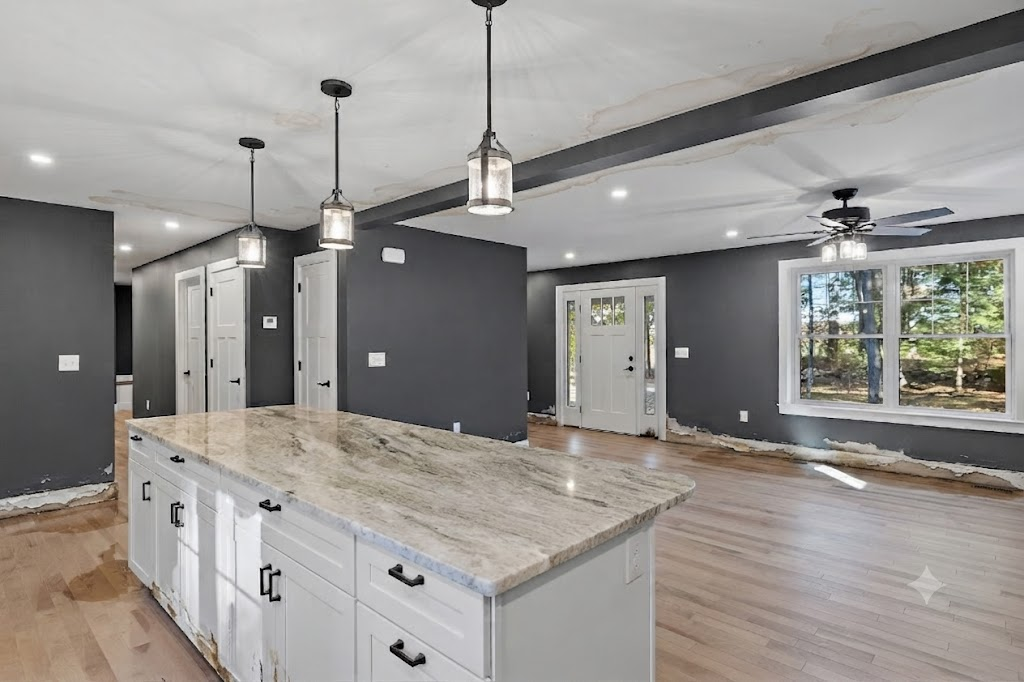 Home interior with water damaged drywall, ceiling, and flooring