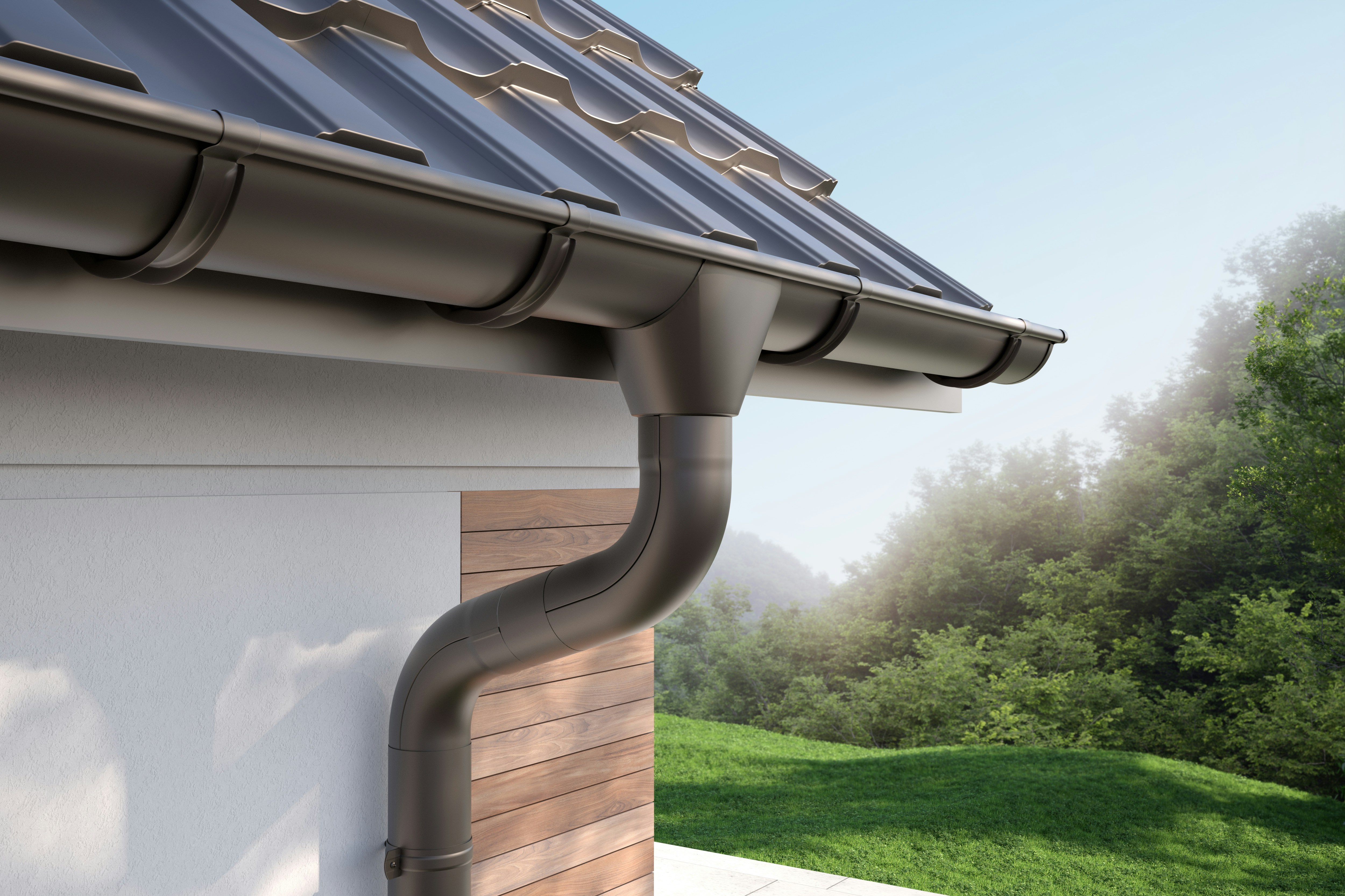 New gutters and downspouts installed on a home