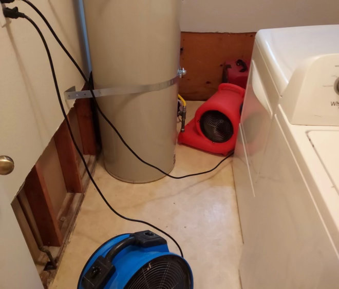 Drying equipment set up in a water damaged room